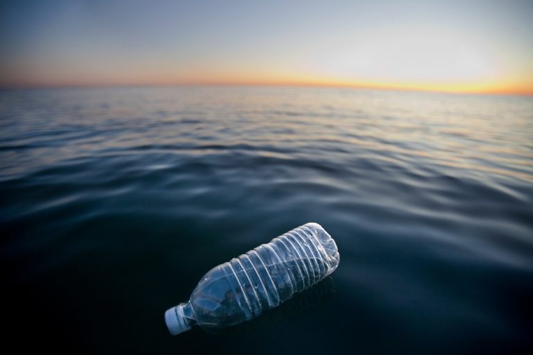 plastic bottle floating in ocean