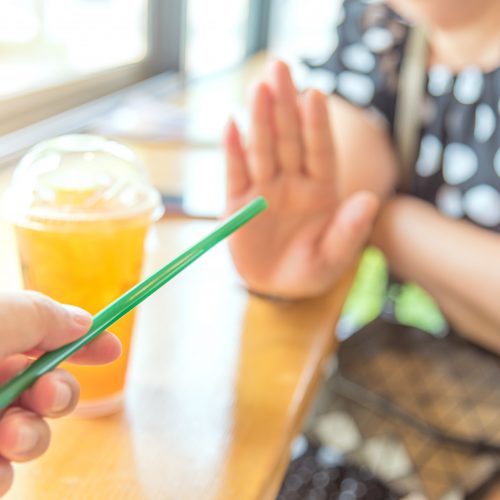 Customer refusing single-use plastic straw